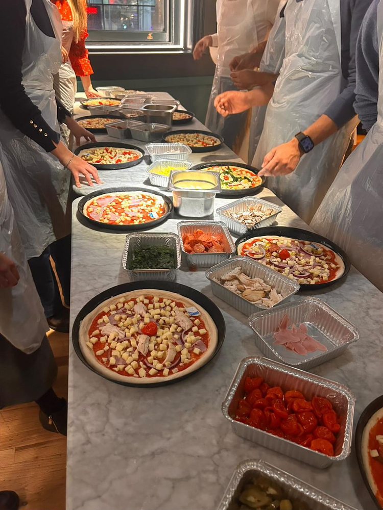 Members at a pizza-making social